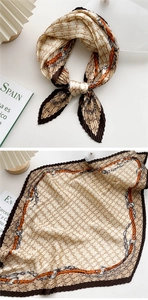 Detail of pleated silk-like scarf with beige orange chain pattern in a stylish bow knot