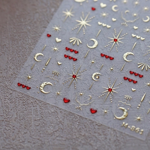 3D heart and moon star nail art stickers with metallic gold and red motifs