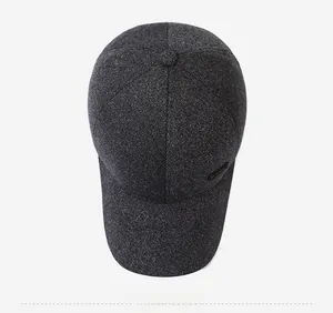 Top view of dark grey baseball cap showing textured knit fabric and sport label