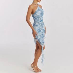 Detail of blue and white tie-dye halter dress featuring side ruching and ruffled hem