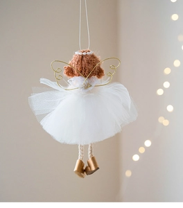 Close-up of a handmade crochet Christmas angel with white tulle skirt and golden wings