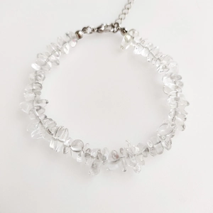 Detail of irregular clear quartz beaded bracelet with silver lobster clasp and extender chain