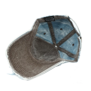 Detail view of denim cap interior featuring cotton lining and reinforced inner taping