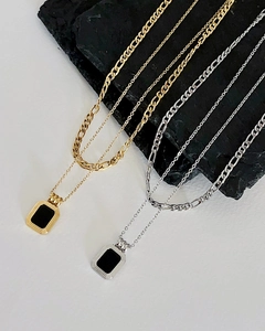 Detail showing vintage black square pendant with double layered gold and silver chains
