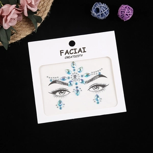 Blue and silver crystal facial rhinestones arranged in a floral crown pattern detail