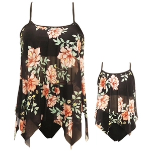 Matching mother daughter floral swimsuits with black mesh overlay and orange flowers