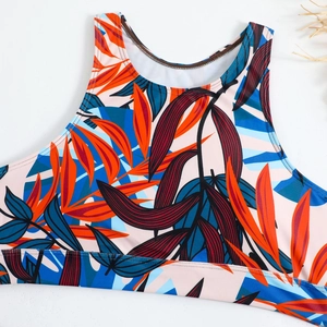 Macro detail of tropical palm print swimwear fabric with high-quality flatlock stitching