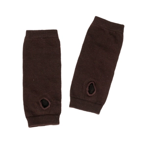 Detailed view of dark brown knitted arm warmers with ribbed cuffs and thumb hole