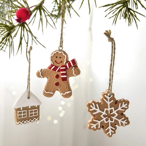 Christmas resin gingerbread man house and snowflake ornament set with rustic twine
