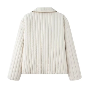 Back view of a cream quilted cotton jacket with clean vertical stitching and casual fit