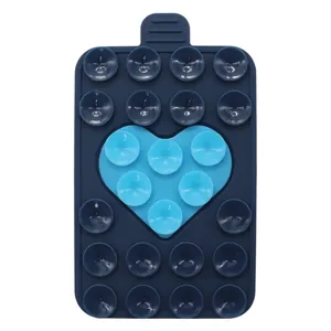 Detailed view of dual-color heart silicone suction cup phone holder with 24 vacuum grippers