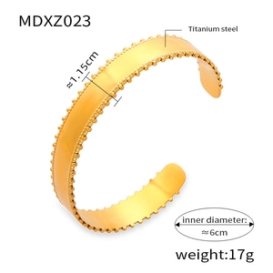 Detailed view of titanium steel gold bangle with precise dimensions and 6cm inner diameter