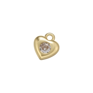 Detail of a gold heart-shaped pendant with a sparkling round micro-pave zircon stone