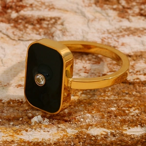 Detailed side view of 18K gold plated ring with black rectangular enamel and crystal
