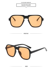 Macro detail of retro pilot sunglasses with black frame and yellow lenses