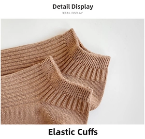 Detailed close-up of ribbed elastic cuff on tan cotton knit ankle socks for women