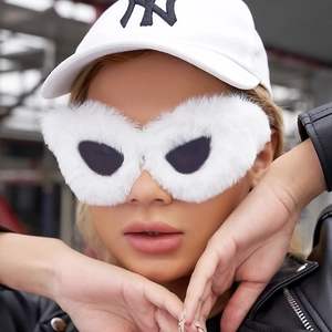 Close-up of stylish white fuzzy cat eye sunglasses with fluffy fur frame for women