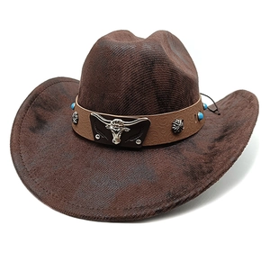 Detail of a brown suede cowboy hat with a decorative leather band and turquoise studs