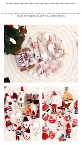 Detail of Christmas tree ornaments including plush gnomes, angels, and wooden stars