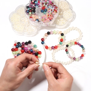 DIY jewelry making kit with colorful imitation pearls in a flower storage case