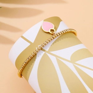 Handmade beaded 18k gold plated bracelet with a pink heart pendant for women