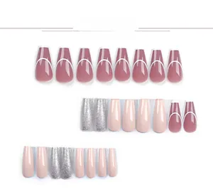 Detail view of pink press-on nails with silver glitter and white curved line designs