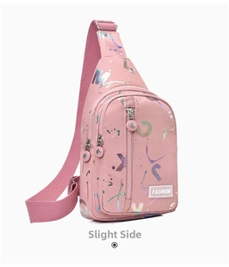 Detailed side view of pink crossbody bag with colorful splash patterns and fashion label