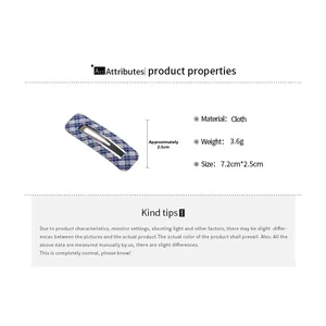 Blue and white checkered fabric hair clip showing 7.2cm by 2.5cm size specifications