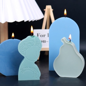 Artistic geometric aromatherapy candles set in mint green and blue tones for home decor