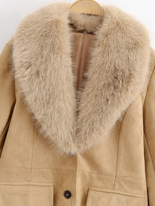 Detailed close-up of camel suede jacket featuring a fluffy detachable faux fur collar