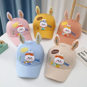Flat lay of colorful toddler baseball hats with 3D bunny ears and Lucky embroidery