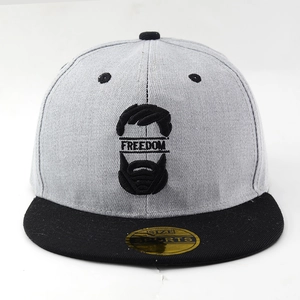 Detailed close-up of Freedom embroidery and mustache graphic on grey baseball cap