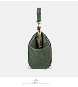 Side view detail of a dark green retro kiss-lock bag with matte textured leather and metal clasp