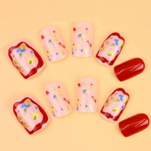 Burgundy red and floral press-on nails with glossy finish for elegant manicure sets