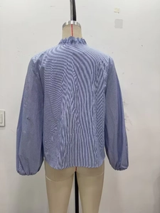 Back view of a blue and white striped poplin shirt with a ruffled collar detail