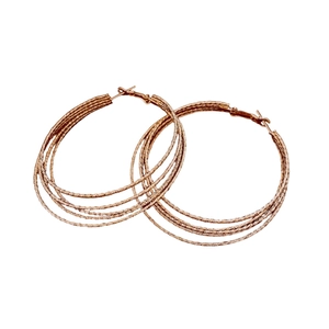 Multi-layered gold hoop earrings with textured finish in a minimalist circle design