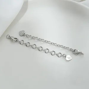 Macro shot of 925 sterling silver extender chains with heart tags and lobster clasps