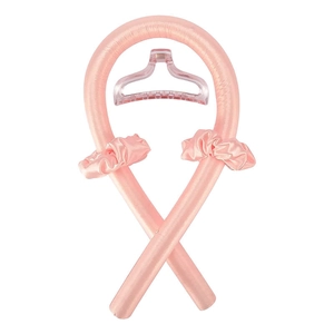 Pink silk heatless curling rod set featuring matching scrunchies and a clear claw clip