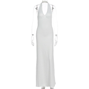 Detail of polka dot halter dress with deep V-neck and backless design for summer