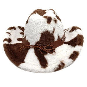 Detailed close-up of cow print cowboy hat showing plush texture and studded leather band