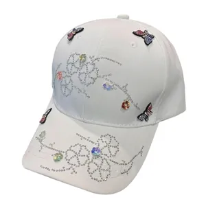 White baseball cap with colorful rhinestones and 3D embroidered butterfly patches