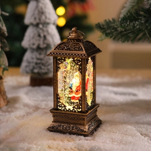 Detail of vintage bronze Christmas lantern with Santa Claus and glitter water feature