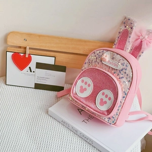 Pink sequin bunny ear backpack with mesh bow and Rabbit embroidery in a lifestyle setting