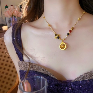 Detailed close-up of a Neo-Chinese gold-plated necklace with colorful beads on a model