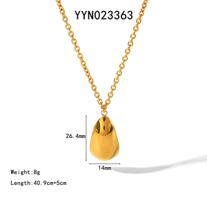 Detailed view of teardrop pendant necklace in gold finish with size measurements
