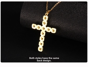 Macro detail of the hollow-out golden cross pendant back with intricate metal structure