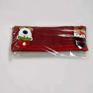 Four-piece Christmas linen handle cover set with 3D snowman and bear decor on a scale