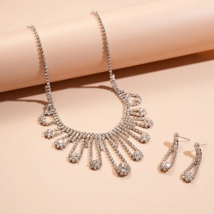 Retro luxury silver fringe necklace and earring set with shimmering crystal diamonds