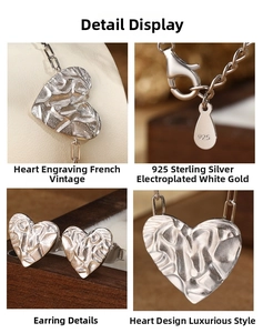 Detail of 925 sterling silver heart jewelry set featuring S925 hallmark and texture