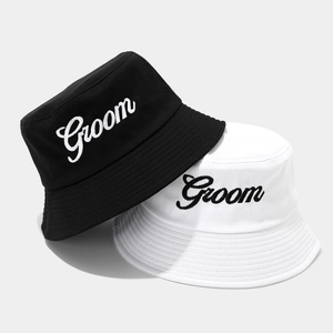 Detailed view of Groom script embroidery on cotton canvas bucket hats for weddings